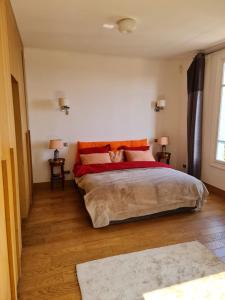 a bedroom with a bed with a cat laying on it at Feet in Water Vila at Saint Jean Cap Ferrat in Saint-Jean-Cap-Ferrat