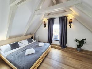 Postel nebo postele na pokoji v ubytování Hotel Desatero