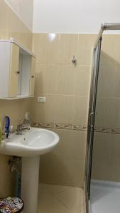 a bathroom with a sink and a shower at Isabel in Durrës