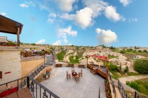 a balcony with a view of a mountain at World Cave House - Hotel & Swimming Pool in Ürgüp