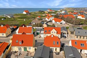 an aerial view of a village with orange roofs at Lovely Holiday Home In The Heart Of Løkken in Løkken