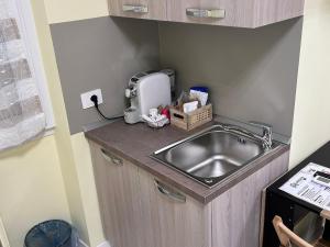 Kuchyň nebo kuchyňský kout v ubytování Urban Suite Milano