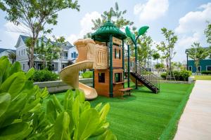 a playground in a park with a slide at AnnA Villa - Novaworld Phan Thiết in Bình Tú