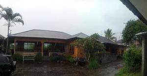 a house with a large window at Volcano 3 hotel in Kintamani
