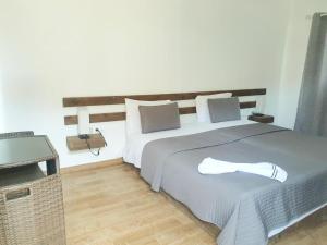 Postel nebo postele na pokoji v ubytování Hotel Salinas São Jorge