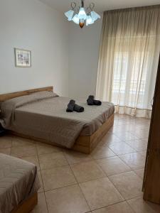 Ένα ή περισσότερα κρεβάτια σε δωμάτιο στο Cave House Castellana Grotte