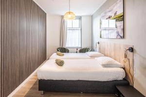 Voodi või voodid majutusasutuse Hotel Over de Brug toas