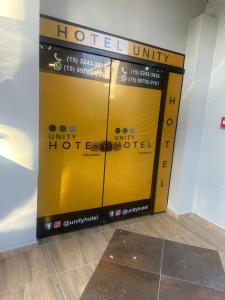 Un certificado, premio, cartel u otro documento en Unity Hotel - Votorantim - SP