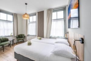 Voodi või voodid majutusasutuse Hotel Over de Brug toas