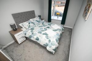 a bedroom with a large bed and a window at 2 Bedroom Flat, Fabulous Views near Beamish Museum in Beamish +23 photos