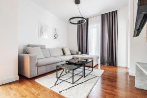 Ruang duduk di Olive Tree Apartments by In Property