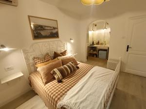 a bedroom with a bed and a bathroom with a sink at Casa Valsecca in Krk
