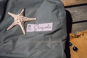 a starfish is sitting on top of a backpack at Sea Side Studios & Houses in Kalo Livadi
