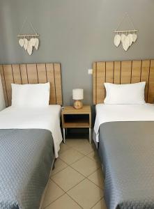 Postel nebo postele na pokoji v ubytování Rondo's Hotel