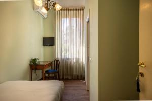 Postel nebo postele na pokoji v ubytování Boutique Hotel Heritage