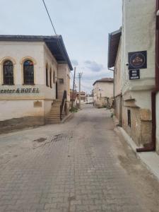 an empty street in a town with a building at KING SOLOMON PALACE in Avanos