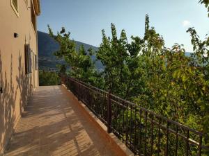 a walkway leading up to a building with a view at Villa in idyllic quiet nature in Benettáta