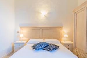 Postel nebo postele na pokoji v ubytování Hotel Corallo