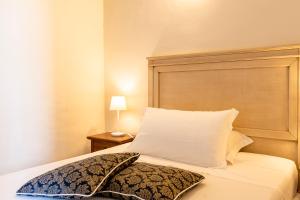 Postel nebo postele na pokoji v ubytování Hotel Corallo