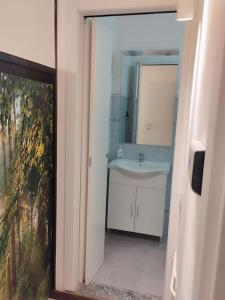 a bathroom with a sink and a mirror at La stella del lago Luxe in Arona