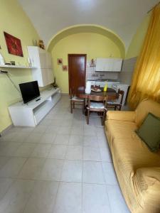 a living room with a couch and a table at La Locanda Del Re in Villalfonsina +26 photos