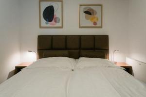 A bed or beds in a room at Apartman Balaton