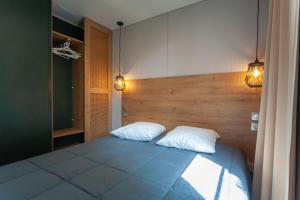 Postel nebo postele na pokoji v ubytování CAMPING & SPA CAP SOLEIL