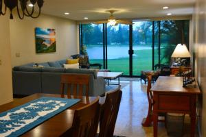 a living room with a couch and a table at Ocean Pearl at Turtle Bay in Kahuku