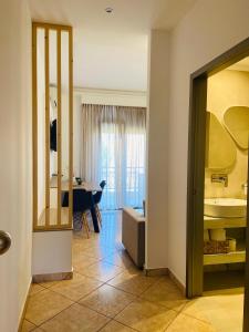 a room with a bathroom with a sink and a mirror at Summer Dreams Studios in Skala Potamias +64 photos