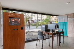 an office with a desk with a computer on it at Exceptionally Located in Honolulu