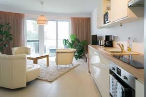 A kitchen or kitchenette at Apartman Balaton