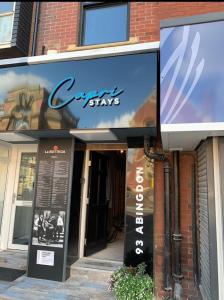 a store front of a building with a sign at Capri Stays - Apartment One in Blackpool