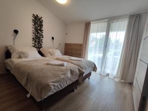 Sweety-Apartman客房内的一张或多张床位