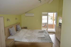 Postel nebo postele na pokoji v ubytování Albatros Comfort like home