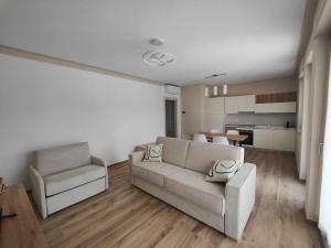 a living room with a couch and a chair at Casa Bramardi in San Defedente di Cervasca