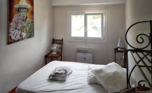 Voodi või voodid majutusasutuse Villa de 4 chambres avec piscine privee jardin clos et wifi a Agde a 1 km de la plage toas