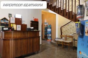 a shop with a cash register and stairs in a store at PAPER MOON in Bellaria-Igea Marina