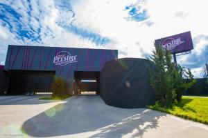 a building with a ramp leading into a garage at Prestige Motel 2 in Curitiba +3 photos