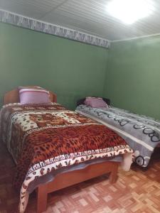 Voodi või voodid majutusasutuse Lucmabamba Dulcesueños Xiomara toas +12 fotot