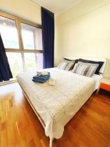 Ένα ή περισσότερα κρεβάτια σε δωμάτιο στο Harmonia Orange Apartment