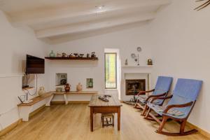 Telewizja i/lub zestaw kina domowego w obiekcie Finca Can Garbeta by Rentallorca