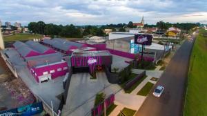 an overhead view of a town with pink buildings at Prestige Motel 3 in Curitiba