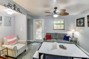 a living room with a couch and a table at Hot Springs Retreat with Private Dock and Hot Tub! in Hot Springs