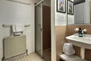 a bathroom with a sink and a shower and a toilet at Snow Gums apartment 3 alpine -Getaways in Dinner Plain