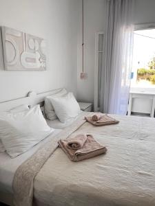 A bed or beds in a room at Vavanos Studios