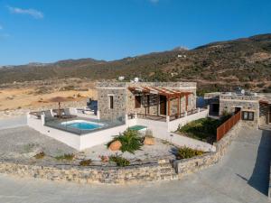 an aerial view of a house with a swimming pool at Apartments Kalaitzakis with private pool in Sitia