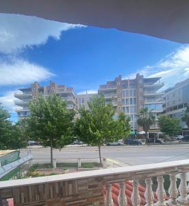 a view from a balcony of a street with buildings at At-Salaj1 in Vlorë +12 photos
