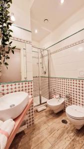 a bathroom with a sink and a toilet and a shower at Il Mare Di Roma in Lido di Ostia