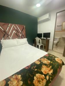 Een bed of bedden in een kamer bij Casa Mango