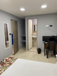 Una cama o camas en una habitación de Casa Mango